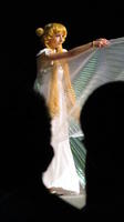 Woman in white dress with translucent “wings”