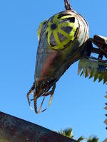 Close up of head of scrap metal sculpture of mantis
