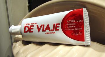 Red and white toothpaste tube