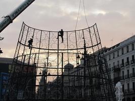 Workers dismantling large (approx. 8 meters) christmas decoration