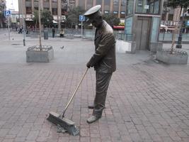 Sculpture of man sweeping street near Plaza Mayor.