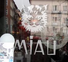 Stylized cat logo on a bar named “Miau”