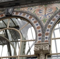 Geometric tilework on arch above window