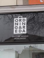 Sign for Ordning & Reda, with letters arranged in rows of three letters inside a bag