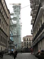 Exterior museum; glassed-in elevator with frosted letters “Reina Sofia”