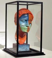 Orange and light blue mask of a woman