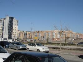 Long view of three multi-story apartment buildings