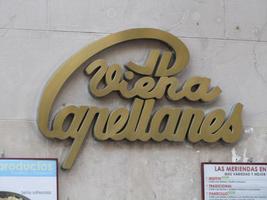 Sign for Viena Capellanes; the C curves over the top of the logo