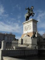 Statue of mounted rider in front of royal palace