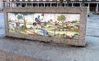 ceramic tiles on a bench showing scene from Don Quijote