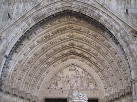 Nested arches above cathedral door, with relief carvings
