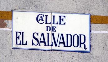 Street sign with word “Calle” written with the “a” inside the “C”.