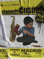 Advert for a band showing child lighting fuse to dynamite sticks in opening of a saxophone