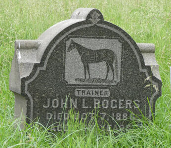 Headstone with picture of horse, and word TRAINER underneath.