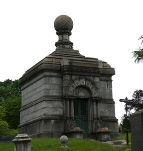 Mausoleum with globe on top.
