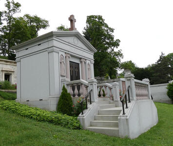 Mausoleum with stairs leading up to a “porch”.
