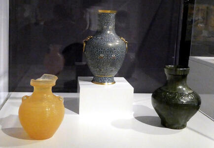Yellow rubber gel vase, ancient blue ceramic vase, and black ceramic vase