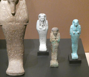 Three small carvings of sarcophagi