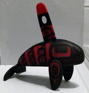 Inuit-style whale with red stripes on black