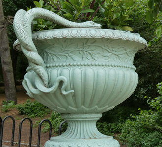 Planter with intertwined serpents as handle