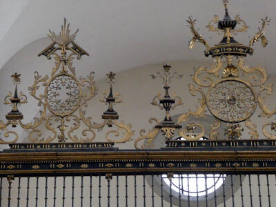 Ornate metalwork above gate