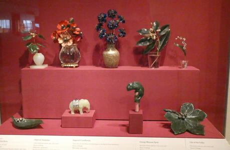 Upper half: glassware vases with flowers; lower half: glassware animals