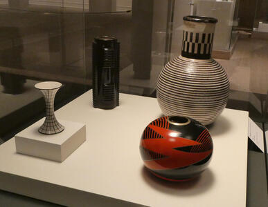 Lacquered metal vases; round, hourglass, cylindrical, and short-necked