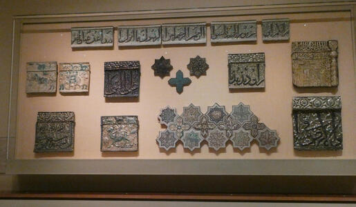 Display case of ceramic tablets with Arabic script on them