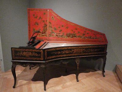 Piano with red-painted lid