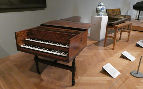Harpsichord with two keyboards and dark wood frame
