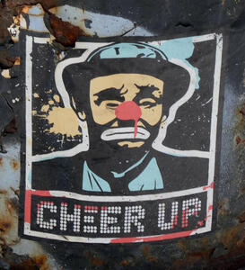 Sticker with “sad clown“ Emmett Kelly; text says “CHEER UP”