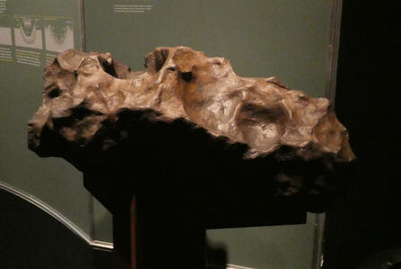 Large irregularly shaped brown meteorite