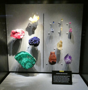 Display of green, red, yellow and purple samples of corundum