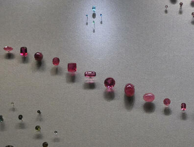 Arrangement of red tourmaline gems from upper left to lower right