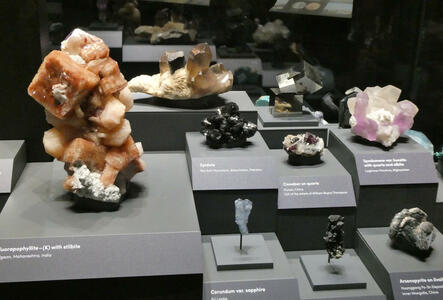 Variety of raw minerals; yellow fluoropophyllite, black epidote, purple spodumene