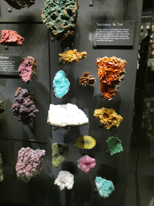 Mineral samples in green, pink, white, aqua, and orange