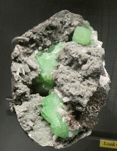 Rock with embedded green crystals