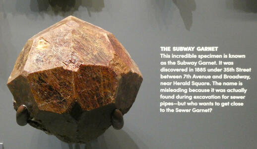 Fist-sized brown garnet cut into shape of icosahedron
