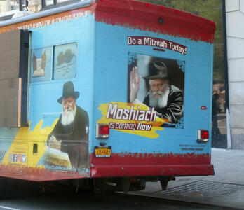 Bus with photo of old rabbi and text: Do a Mitzvah Today! Moshiach (Messiah) is coming Now