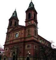 Red brick church with two clock towers