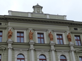 Roman-style statues on top of building