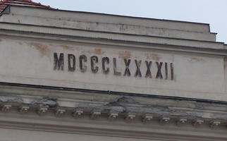 Some buildings have engravings telling when they were built. This one has MDCCCLXXXXII, or 1892.