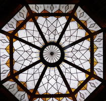 Geometric pattern stained glass skylight with yellow highlights