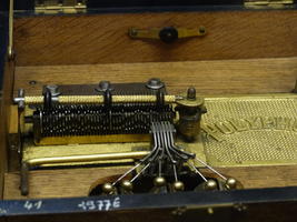 Interior of music box showing cylinder with pins
