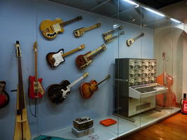 Various modern guitars mounted on wall