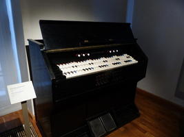 Sixth-tone harmonium (looks like an organ with three rows of keys)