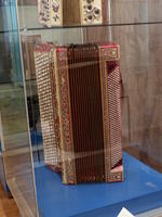 Very large red accordion with hundreds of buttons