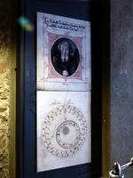 Wall poster showing person who worked on tower, and a diagram of clock face