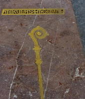 Floor inlay with shepherd's staff and name Mikulas, date MCCLVIII (1257).