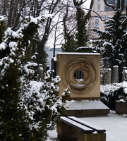 Memorial as square with spiraling circle inscribed within, hole in center